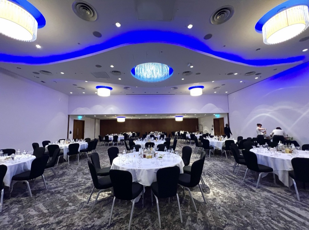 Elegant function room set with round tables for a Bar Excellence cocktail masterclass