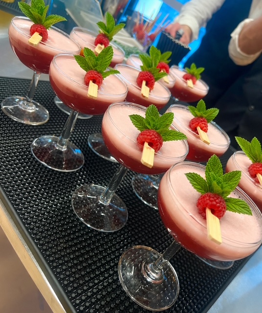 Wellington's Gin Club cocktails garnished with raspberry and fresh mint