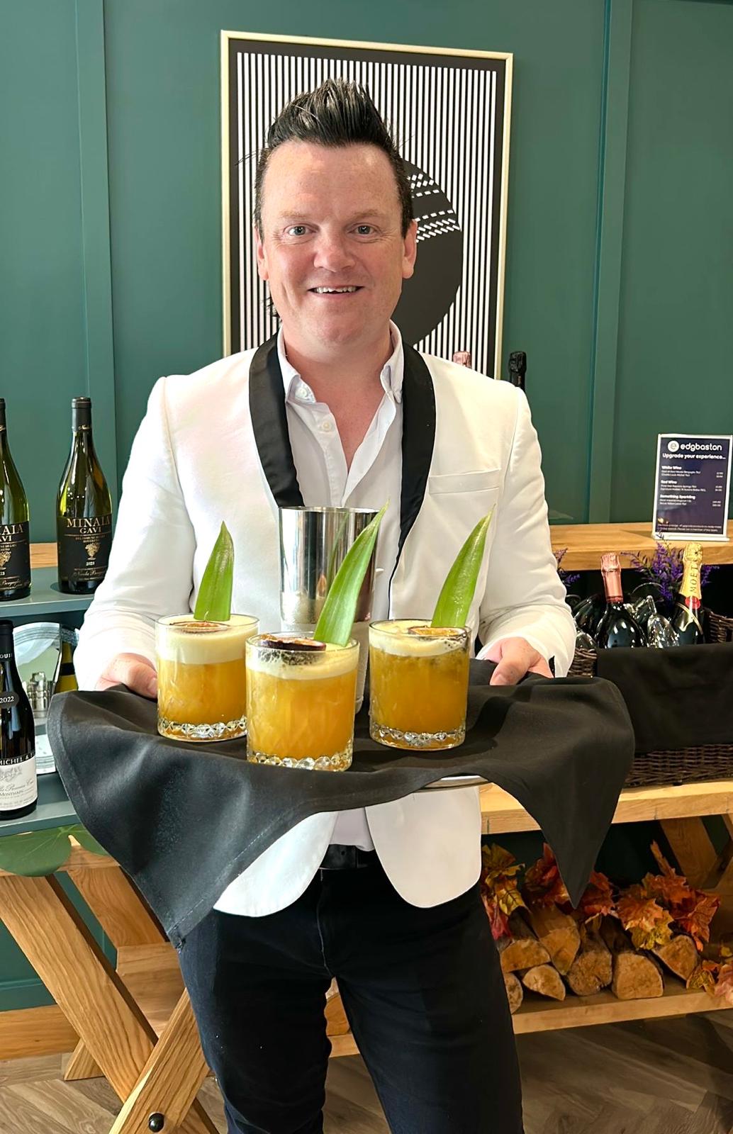 Murdo MacLeod serving signature cocktails in a VIP hospitality setting